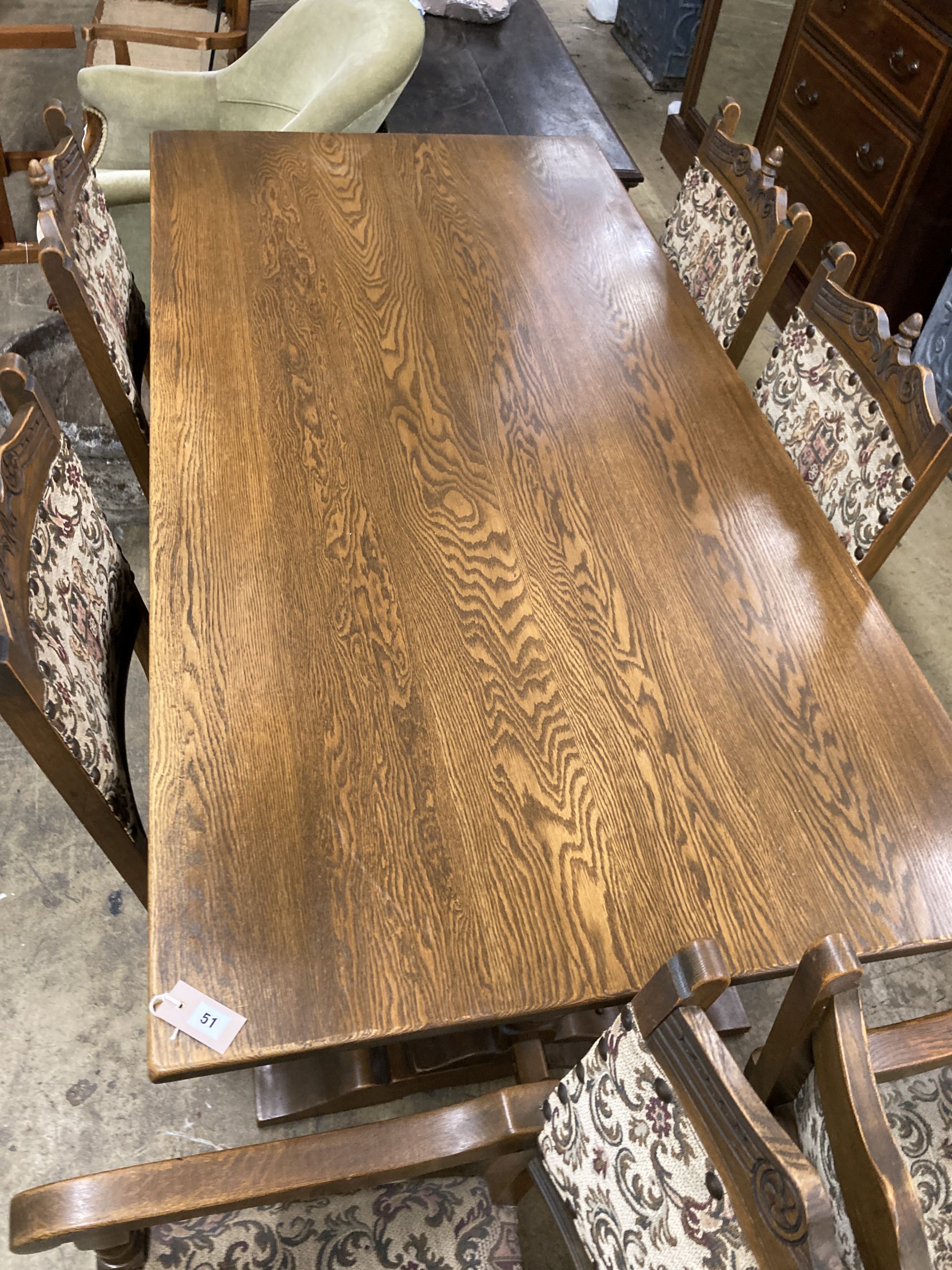 A rectangular 18th century style oak refectory dining table, length 182cm, depth 91cm, height 78cm, together with six matching dining chairs (two with arms)